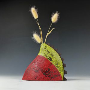 Black vase with red and green crawling glaze (Darlene Pratt)