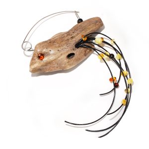 Driftwood brooch with tiny Amber beads in the shape of a bird (Tetyana Lypka)